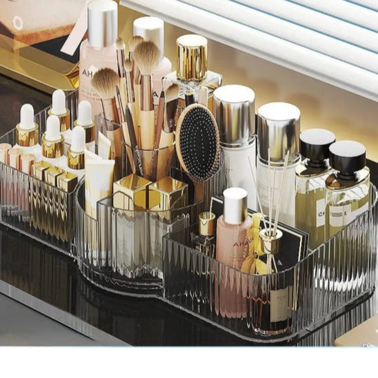 Luxury acrylic makeup organizer by Clarify.pk holding brushes perfumes and beauty products on vanity