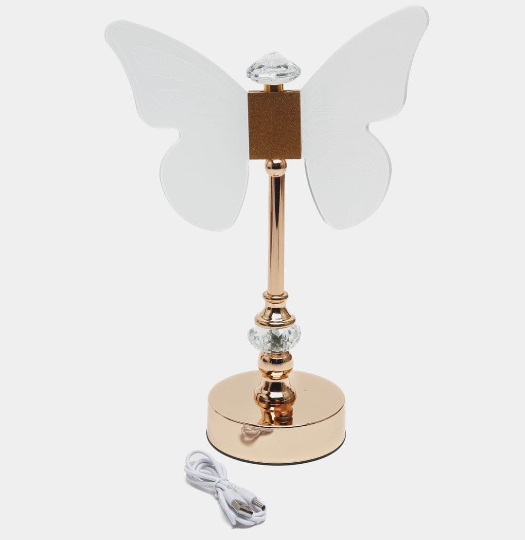 Elegant butterfly table lamp with gold stand and crystal details on a round base with USB cable