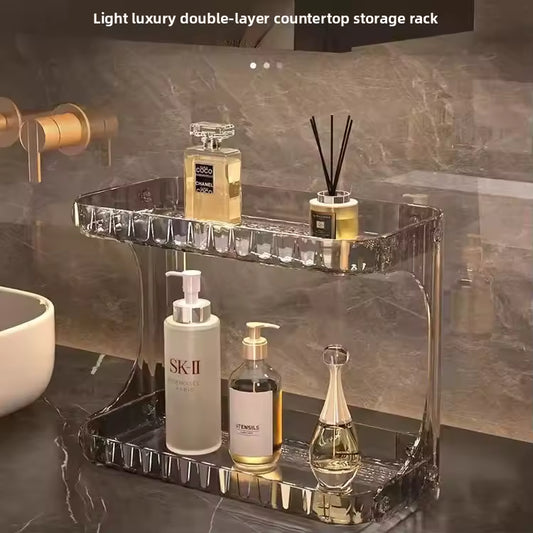 Clear double layer bathroom organizer with perfume and skincare bottles on countertop
