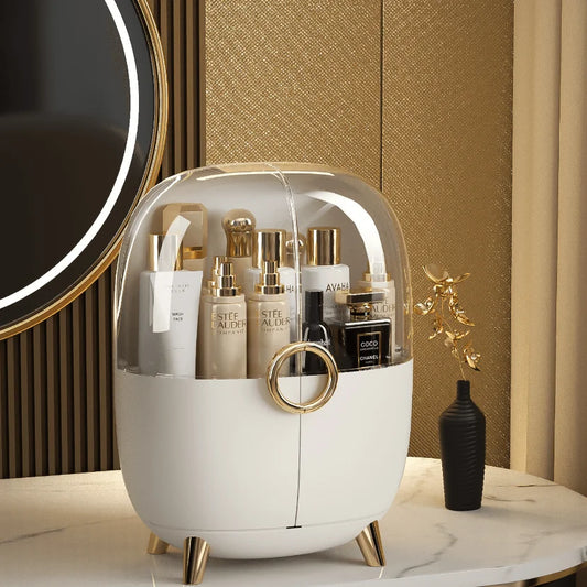 Luxury cosmetics storage box with transparent dome and gold-accented legs holding skincare products