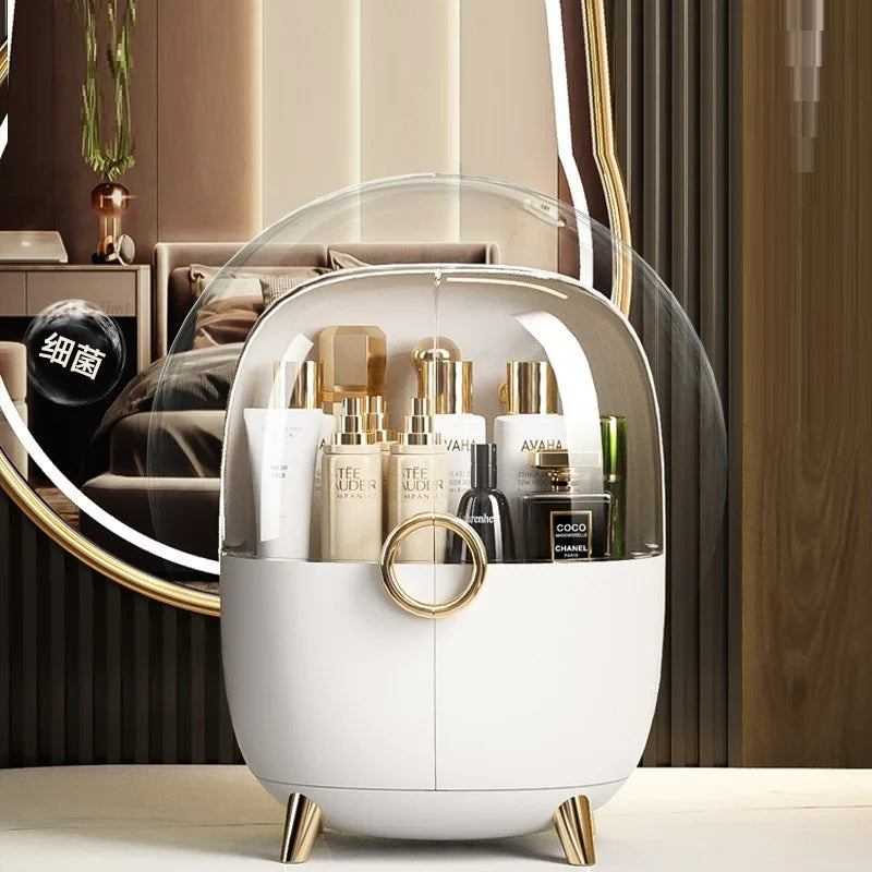 Luxury cosmetics storage box with transparent dome lid and gold accents holding various beauty products