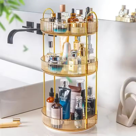 Gold 3 tier cosmetics organizer filled with various skincare and perfume bottles on bathroom counter
