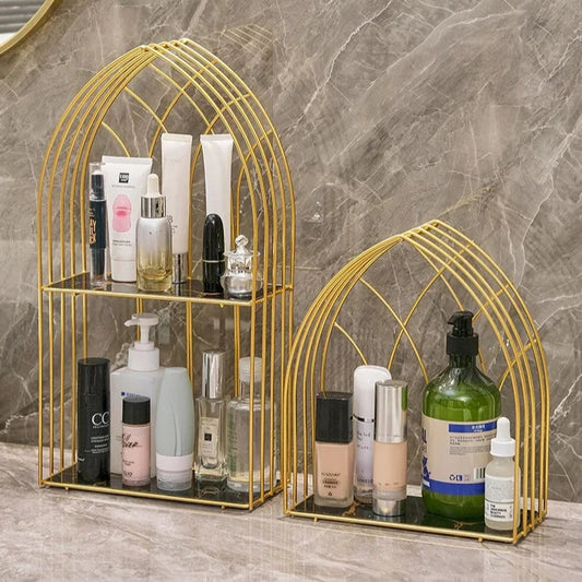 Luxury gold storage rack for bathroom with two-tier metal shelves holding skincare and beauty products