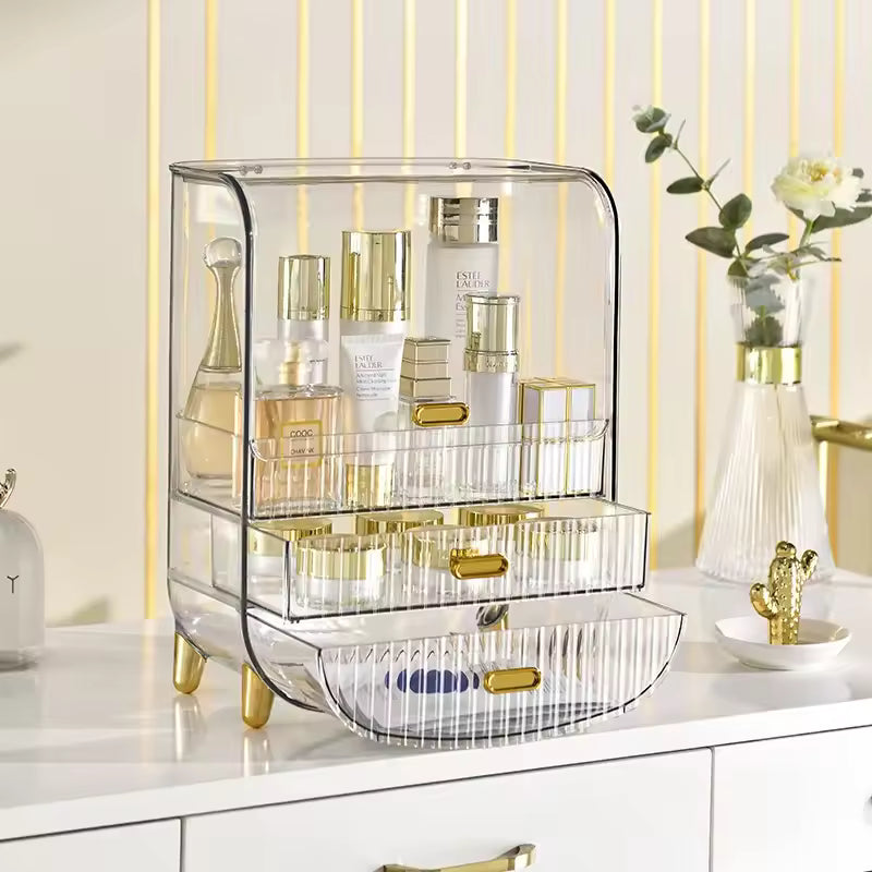 Luxury makeup storage box with clear acrylic design and gold accents holding skincare and makeup products