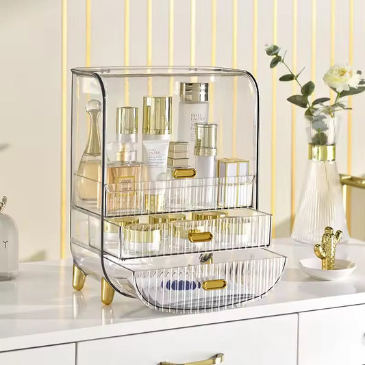 Luxury makeup storage box with clear acrylic design and gold accents holding skincare and makeup products