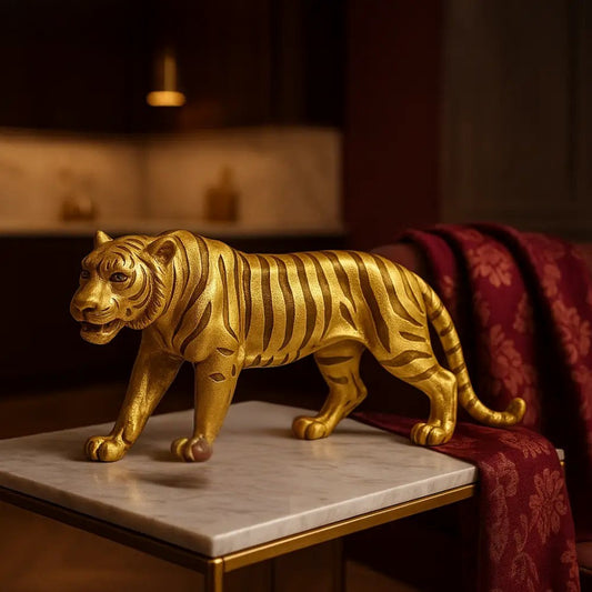 Luxury metallic animal statues gold tiger figurine displayed on marble table with red fabric background