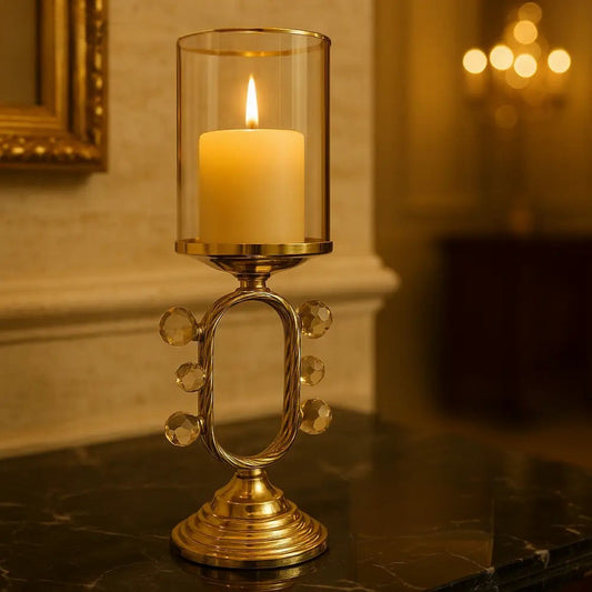 Luxury pillar candle holder with glass and gold metal base adorned with crystal accents