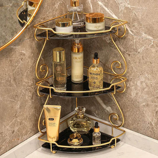 Clarify.pk luxury vanity shelf for bathroom with three-tier gold frame and black glass shelves holding skincare products
