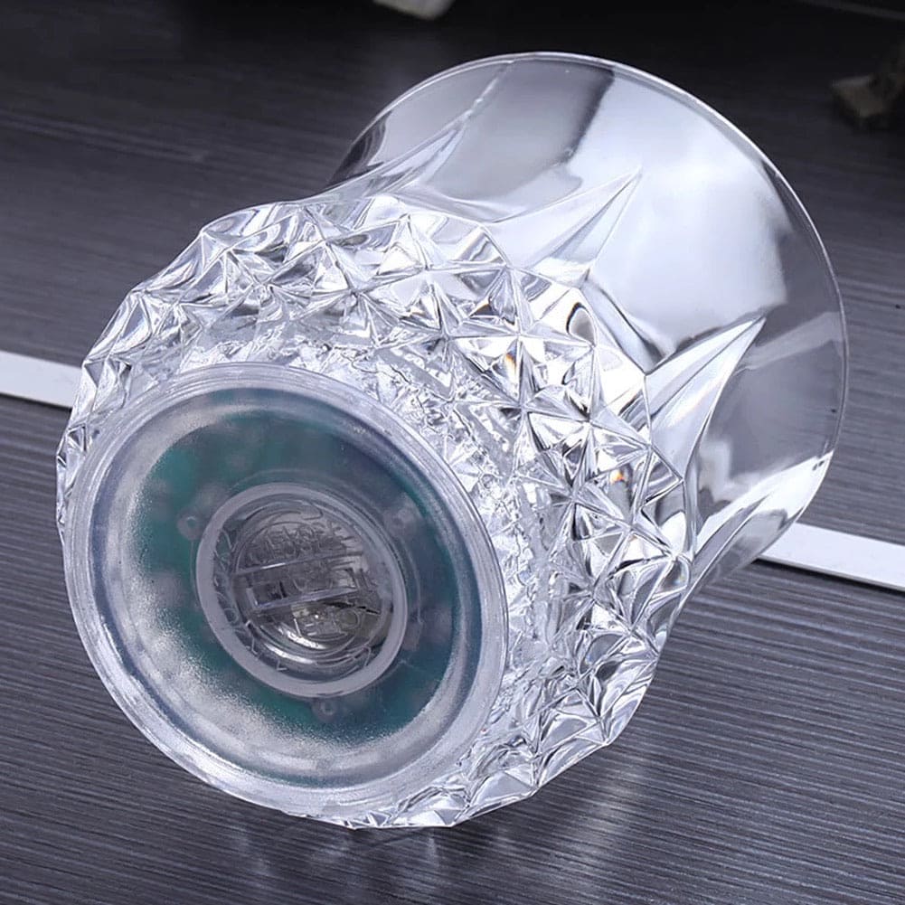 Clear crystal design magic light up acrylic mug with intricate faceted pattern on dark surface