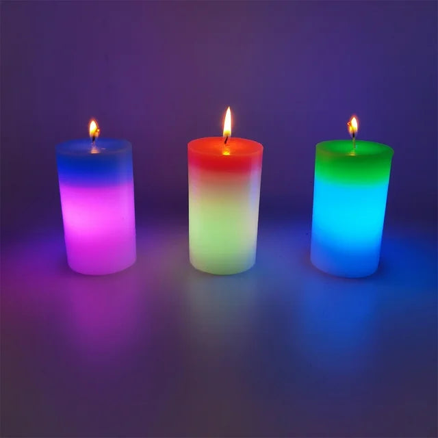 Set of three colorful glowing magic wax mood candles in blue, red, and green hues lit on a dark surface