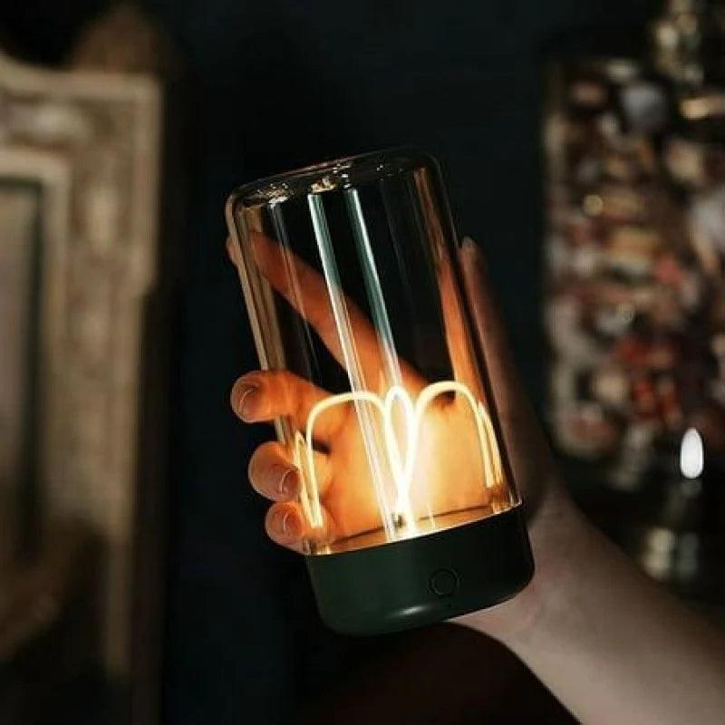 Hand holding a glowing Magnetic LED Desk Light with a modern filament design in a dark setting