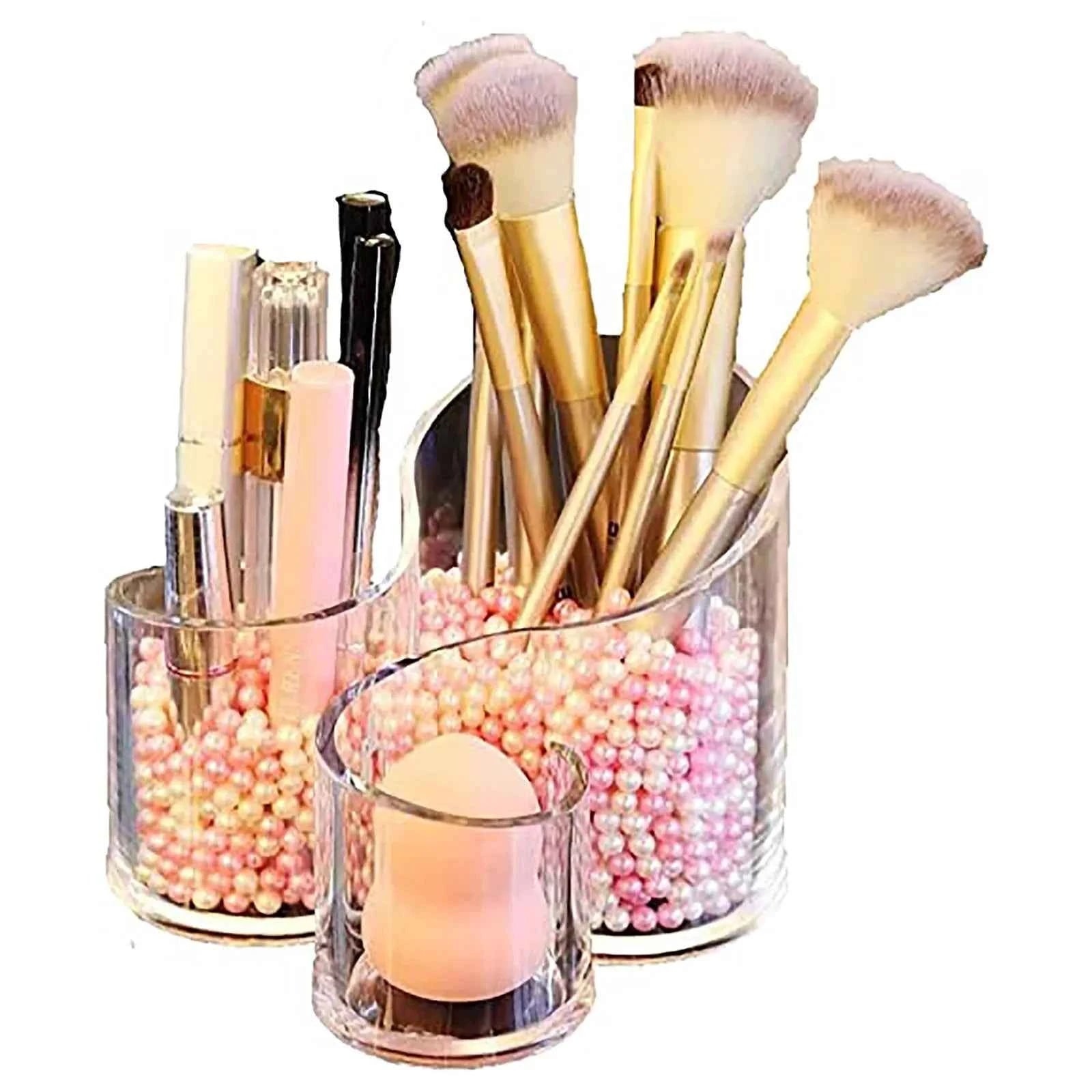 Stylish makeup brush holder acrylic with multiple compartments and decorative pink beads
