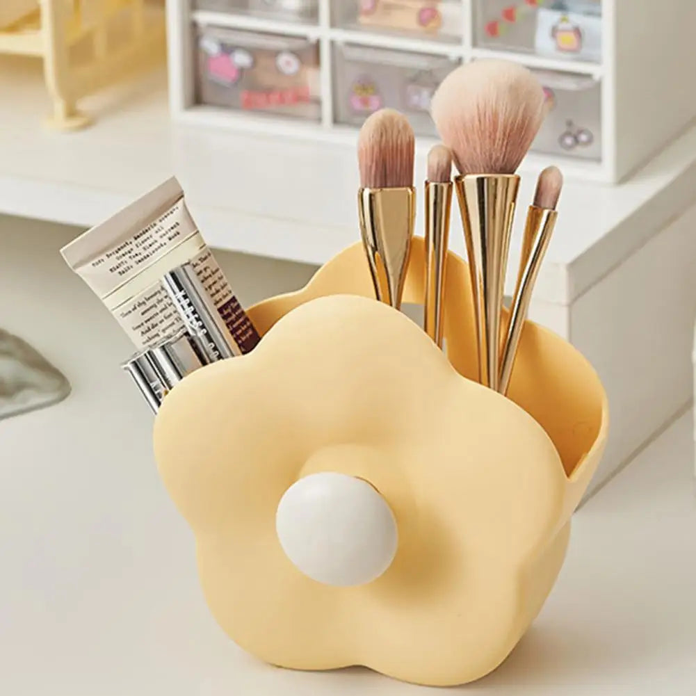 Clarify.pk yellow flower-shaped makeup brush organizer box holding brushes and cosmetics