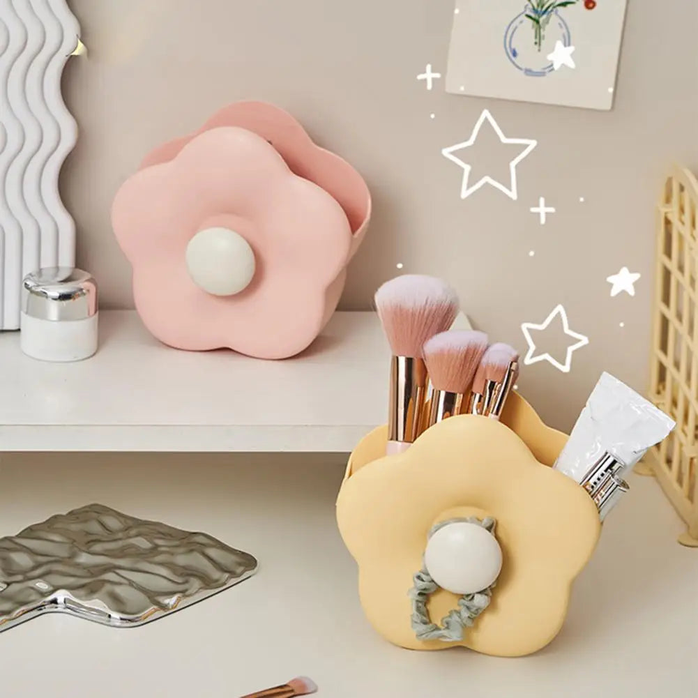 Clarify.pk makeup brush organizer box in flower shape holding makeup brushes and cosmetics on a vanity