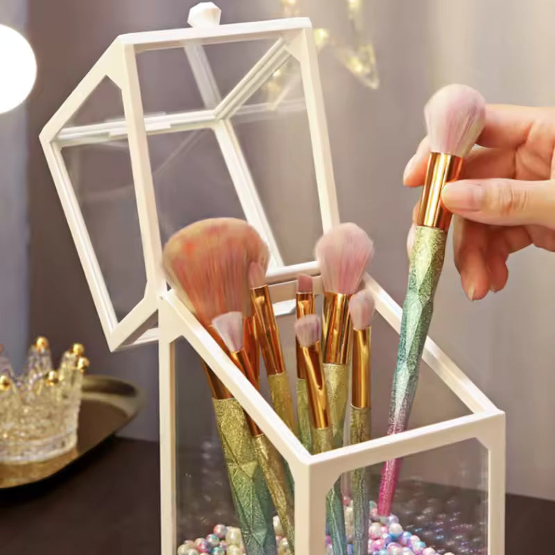 Clear makeup brush storage box from Clarify.pk holding glitter handle brushes with pink bristles