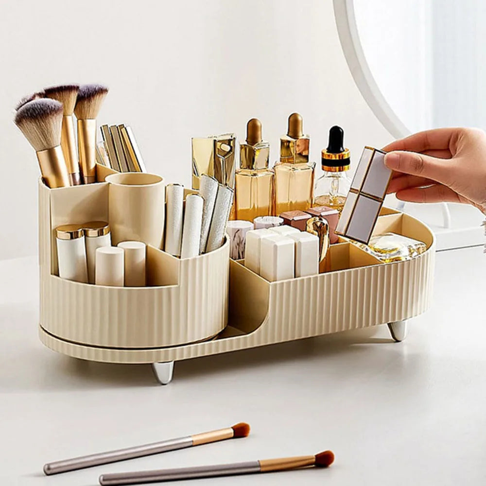 Beige makeup organizer for vanity with multiple compartments holding brushes and cosmetics on white surface