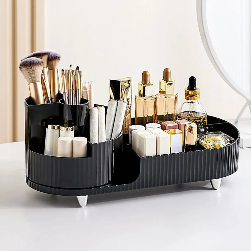 Black makeup organizer for vanity with multiple compartments holding brushes, lipsticks, and bottles