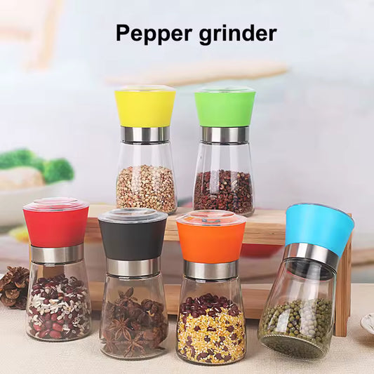 Manual salt and pepper grinder set with colorful tops and clear glass bodies by Clarify.pk