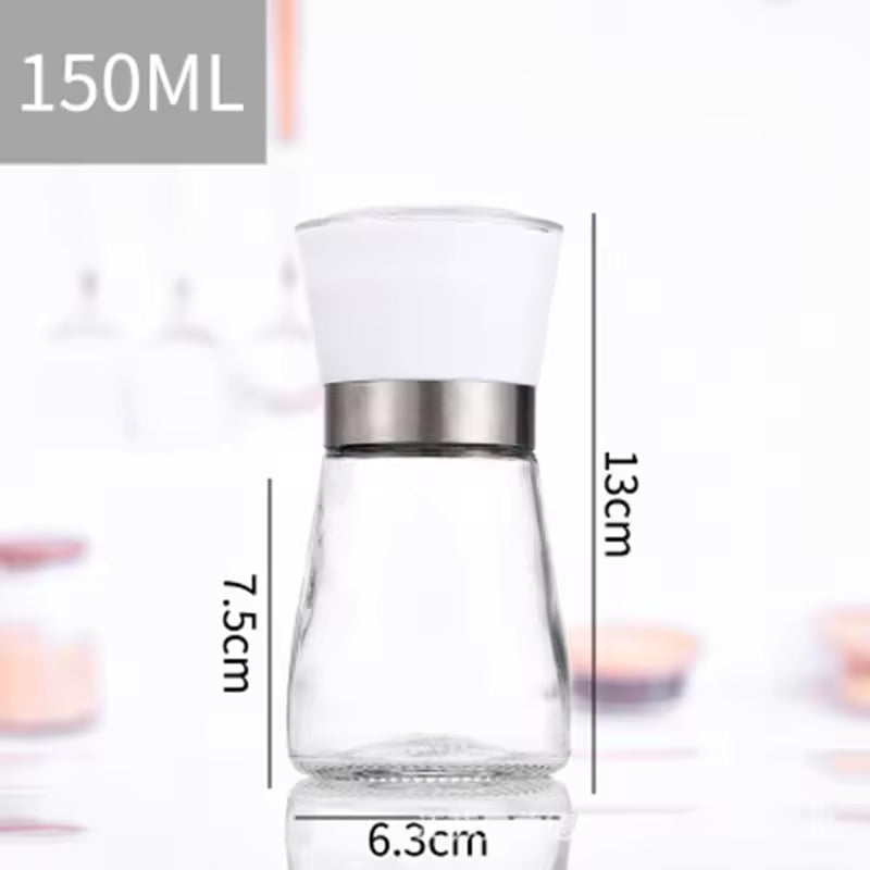 Clear manual salt and pepper grinder with white top and stainless steel band measuring 13 cm high