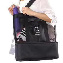 Clarify.pk black mesh beach bag with pockets holding an umbrella and other items