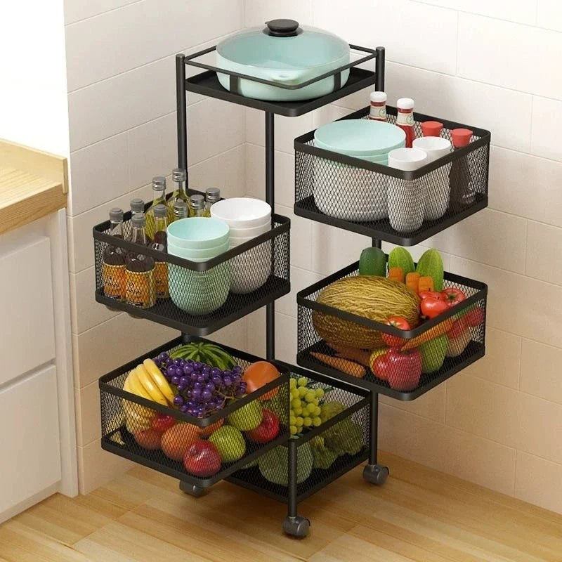 Clarify.pk black metal kitchen storage basket with multiple tiers holding fruits, vegetables, bottles, plates, and cookware