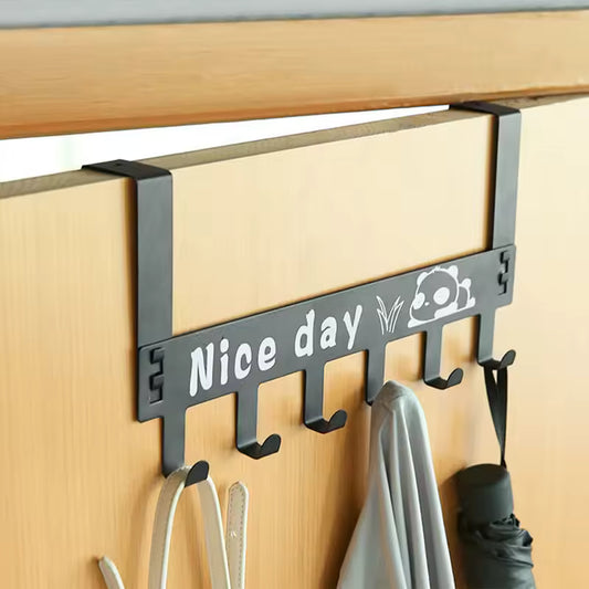 Black over the door hanger rack with Nice day text and six hooks holding bags, cloth, and umbrella