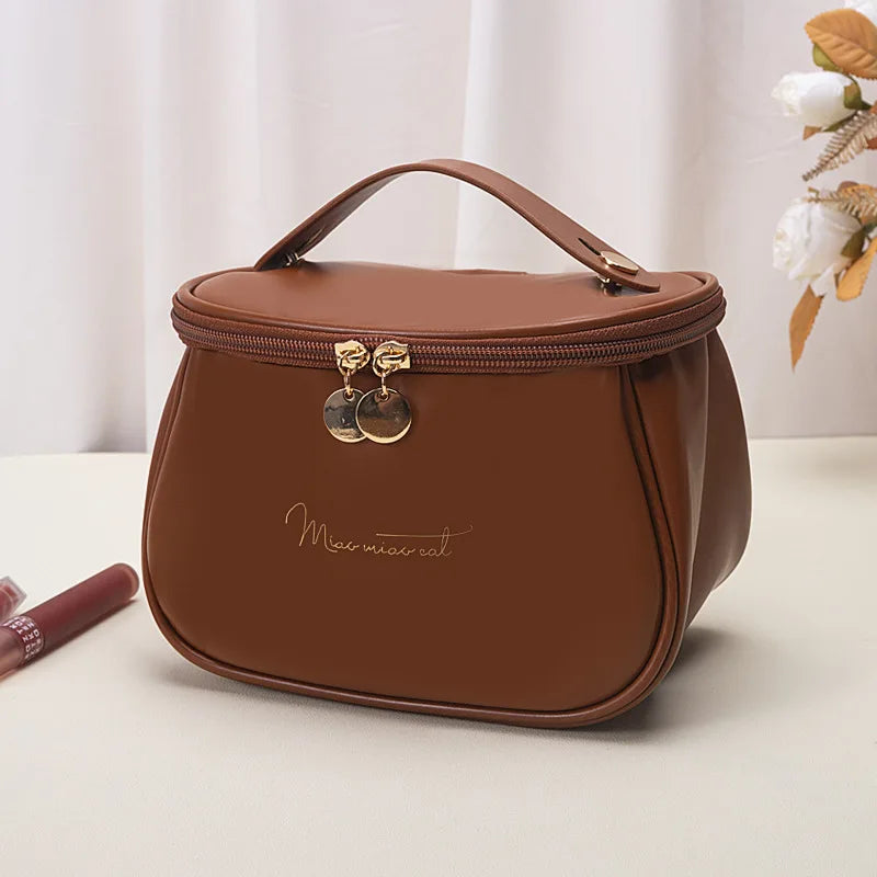 Brown portable makeup case with zipper and handle for easy carrying by Clarify.pk