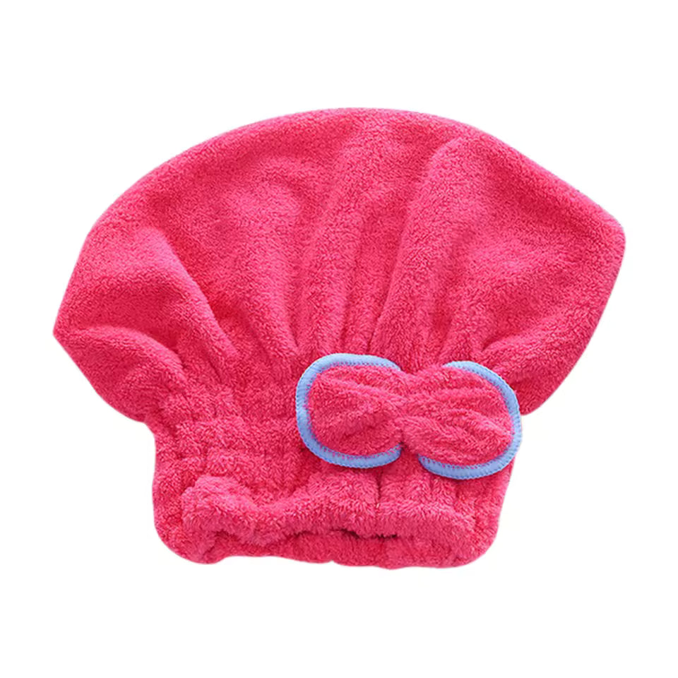 Pink microfiber hair drying towel cap with blue trim bow and elastic band for secure fit