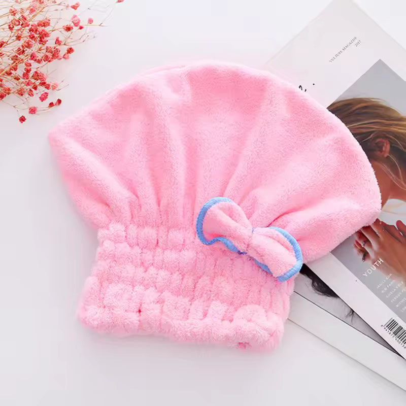 Pink microfiber hair drying towel cap with blue-trimmed bow by Clarify.pk for quick hair drying