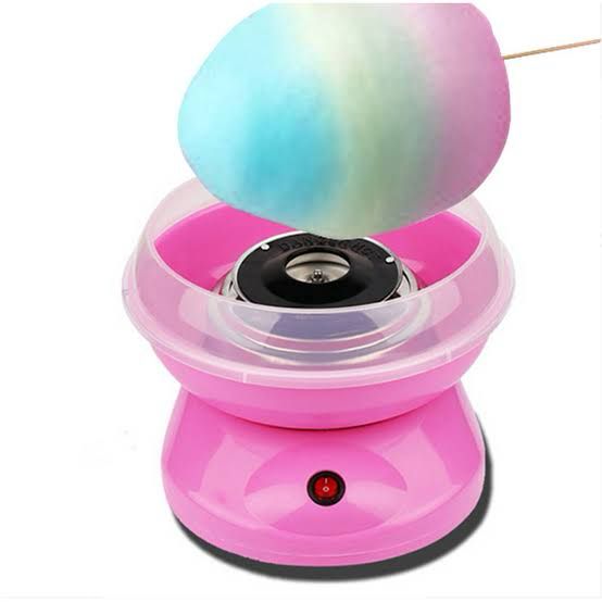 Pink mini cotton candy machine from Clarify.pk making colorful blue and pink cotton candy
