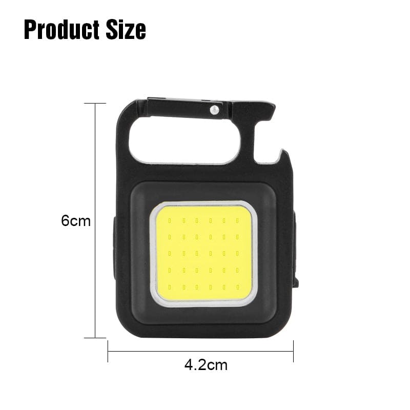 Compact black mini LED flashlight keychain with dimensions 6cm by 4.2cm for portable use