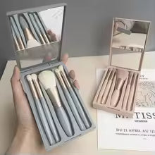Mini makeup brush set with case in gray featuring five brushes and a built-in mirror