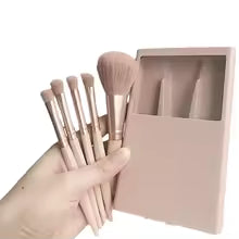 Clarify.pk mini makeup brush set with case in soft pink held in hand with compact storage box