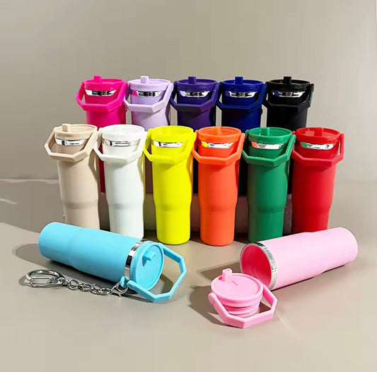 Colorful mini tumbler keychain collection with various vibrant shades and detachable lids