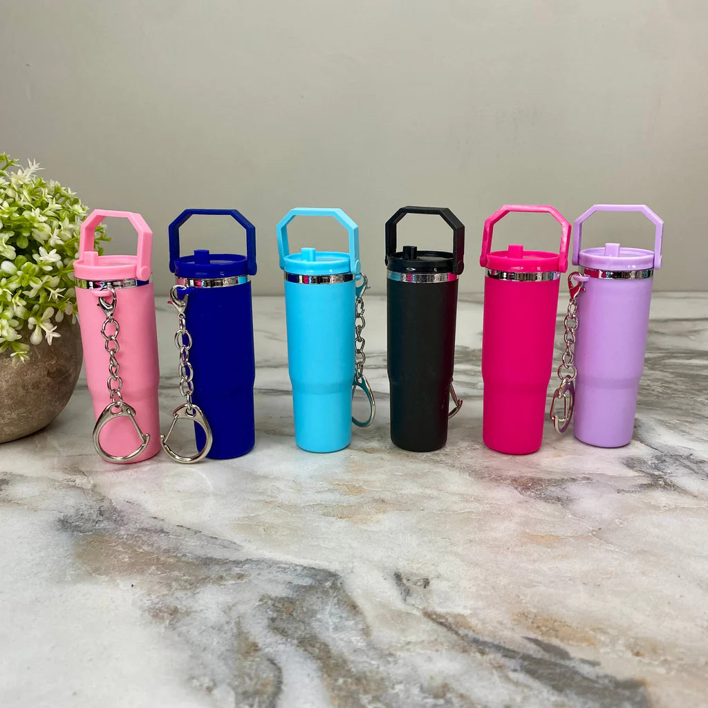 Set of colorful mini tumbler keychain in pink blue black and purple with attached key rings
