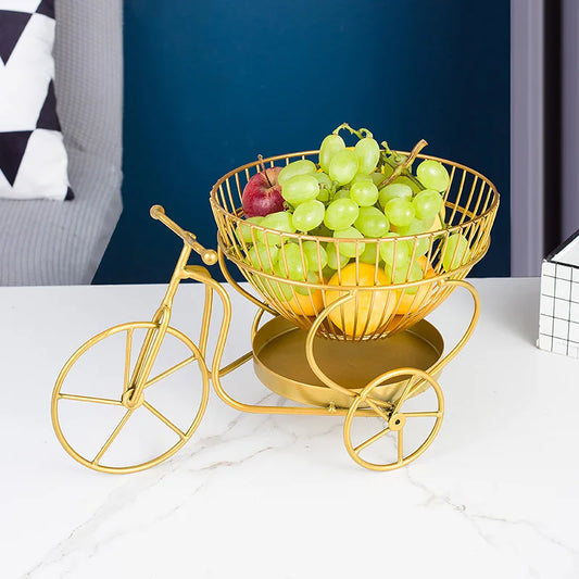 Clarify.pk gold metal tricycle modern fruit basket filled with grapes and assorted fruits