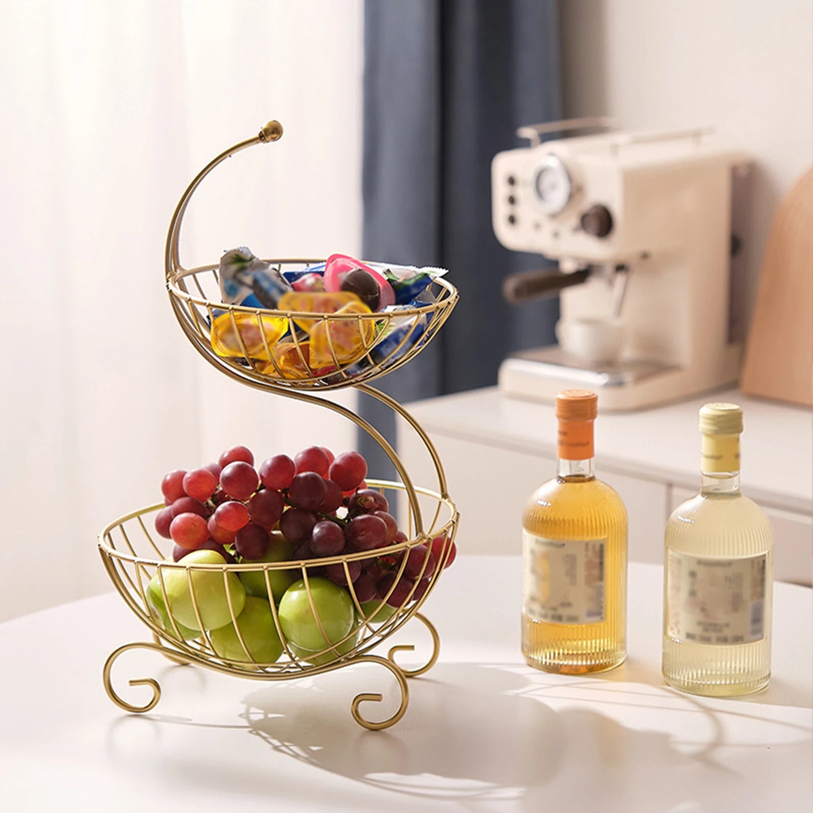 Clarify.pk modern fruit basket stand with two tiers holding grapes and apples in kitchen