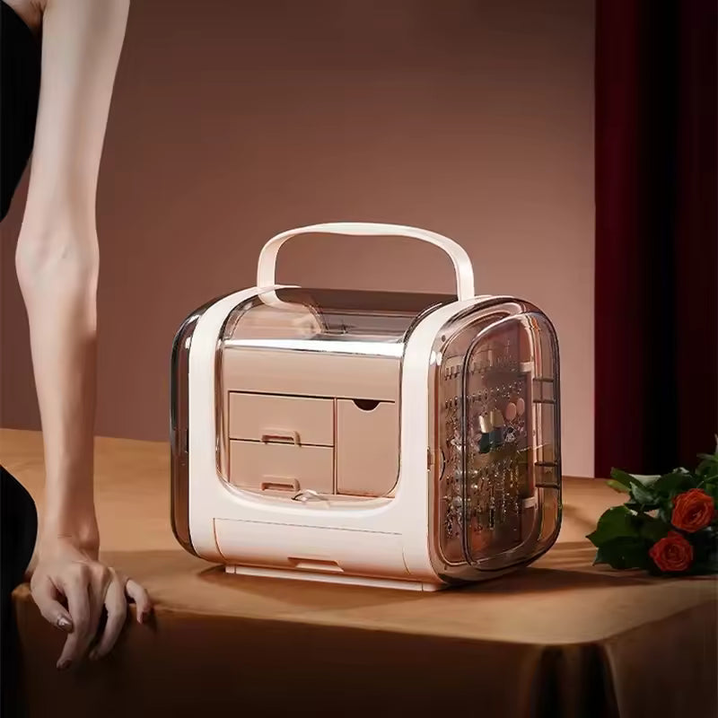 Modern jewelry storage box with drawers in light pink transparent design on wooden table