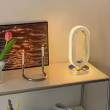 Modern luxurious nordic desk lamp on a sleek desk with decorative items and warm lighting
