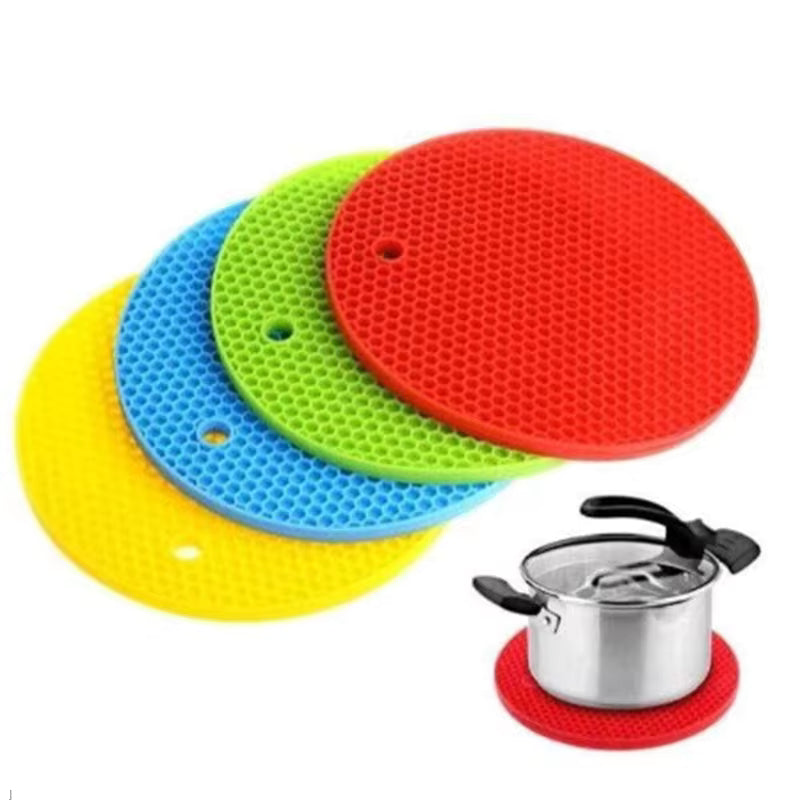 Clarify.pk colorful silicone heat resistant mat set with red mat holding a cooking pot