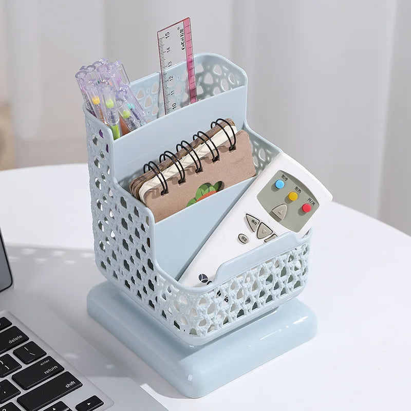 Clarify.pk multi compartment desk organizer in light blue holding remote, notebook, pens, and ruler on white desk