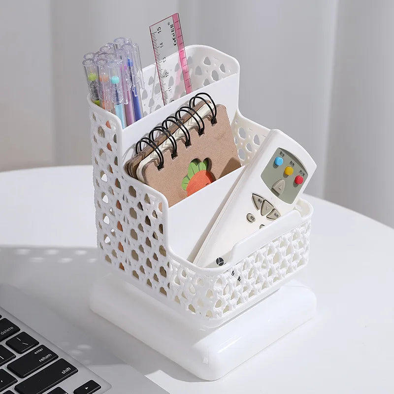 Clarify.pk white multi compartment desk organizer holding pens, ruler, notebook, and remote control on white desk