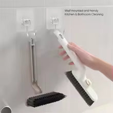 Multi-function crevice cleaning brush with handle for kitchen and bathroom use hanging on wall
