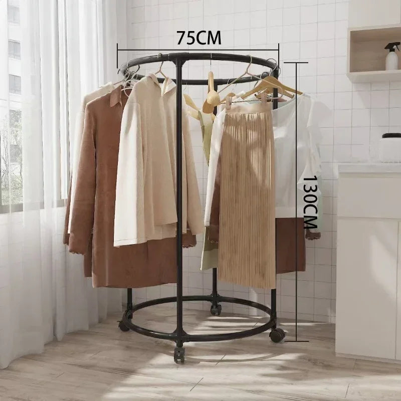 Multi functional coat hanger for clothes in black metal with wheels, holding various jackets and skirts