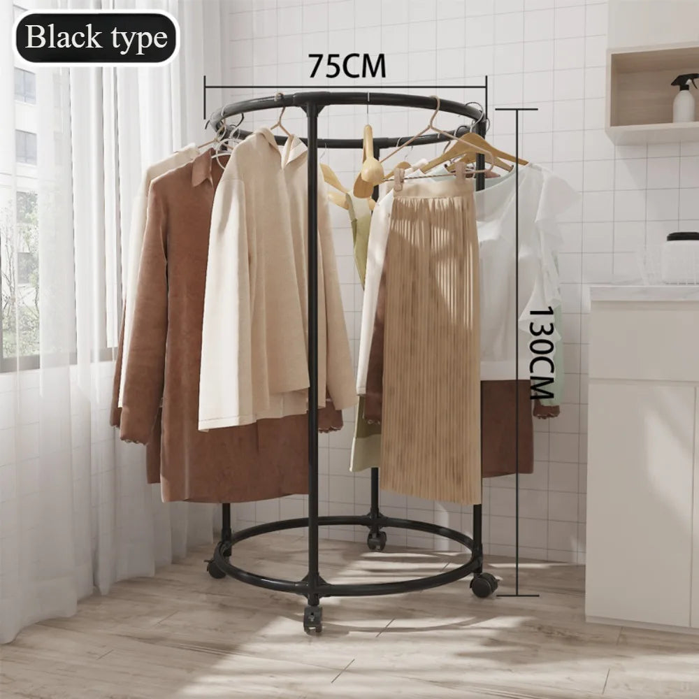 Black multi functional coat hanger for clothes with round frame and wheels holding coats and skirts