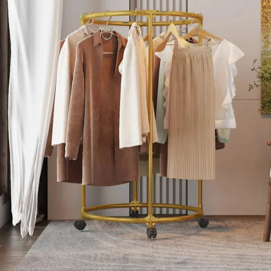 Clarify.pk multi functional coat hanger for clothes in gold with wheels holding various coats and skirts
