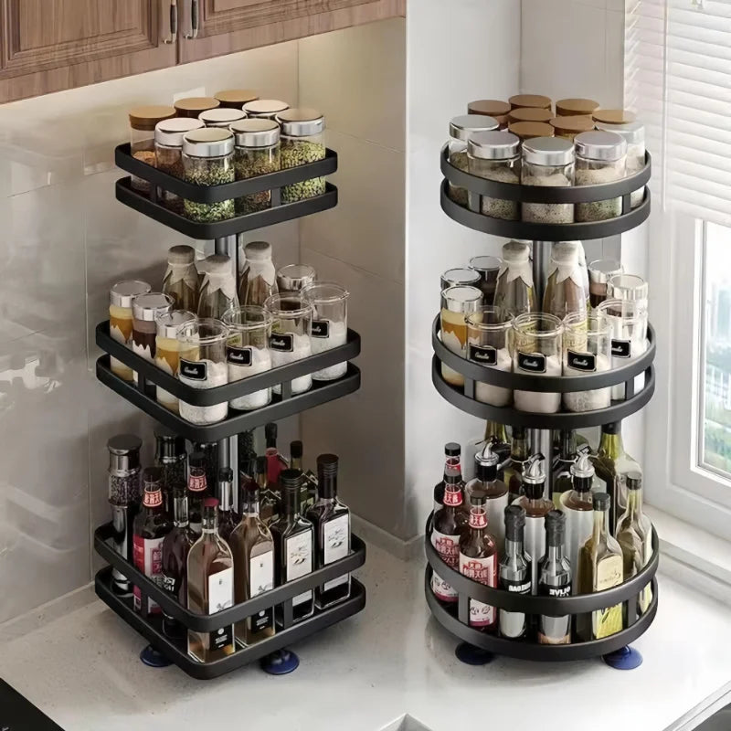 Black multi-layer kitchen storage organizer with spice jars and bottles on kitchen counter