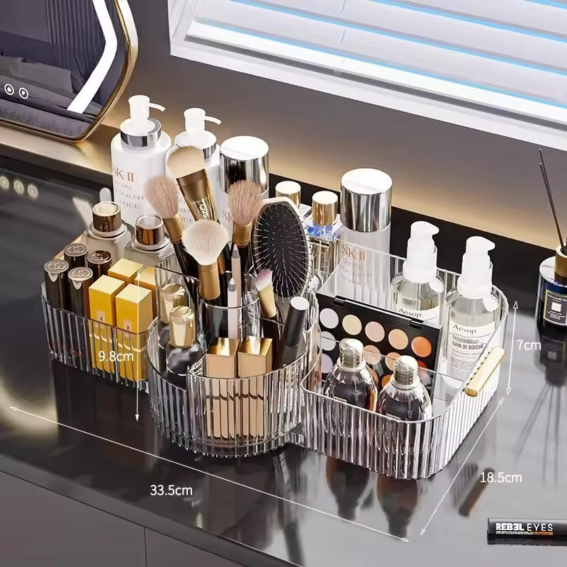 Clear multi-layer makeup storage rack by Clarify.pk organizing brushes, bottles, and cosmetics on a vanity