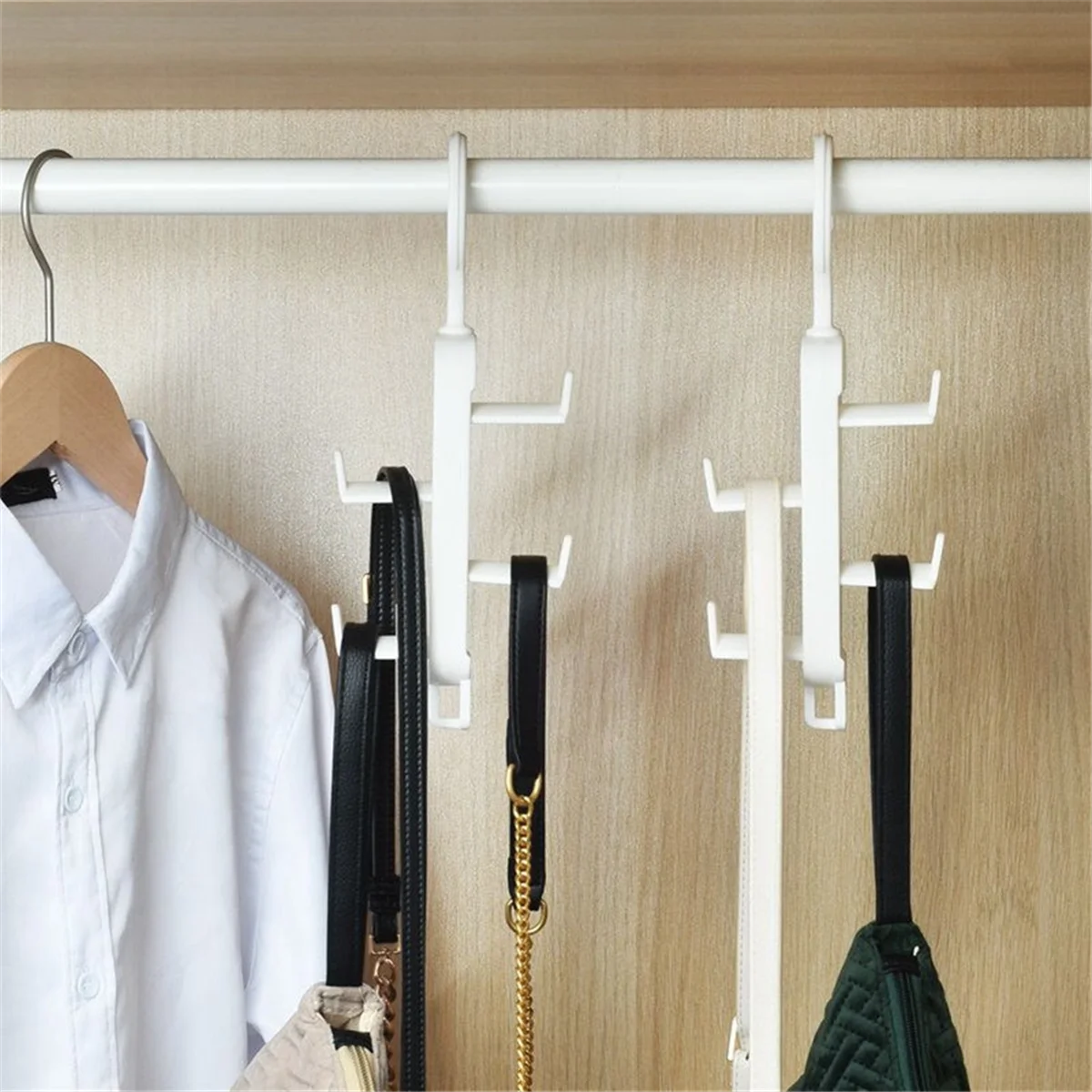 Clarify.pk white multi-purpose hanging rack organizer holding belts and bags on a closet rod