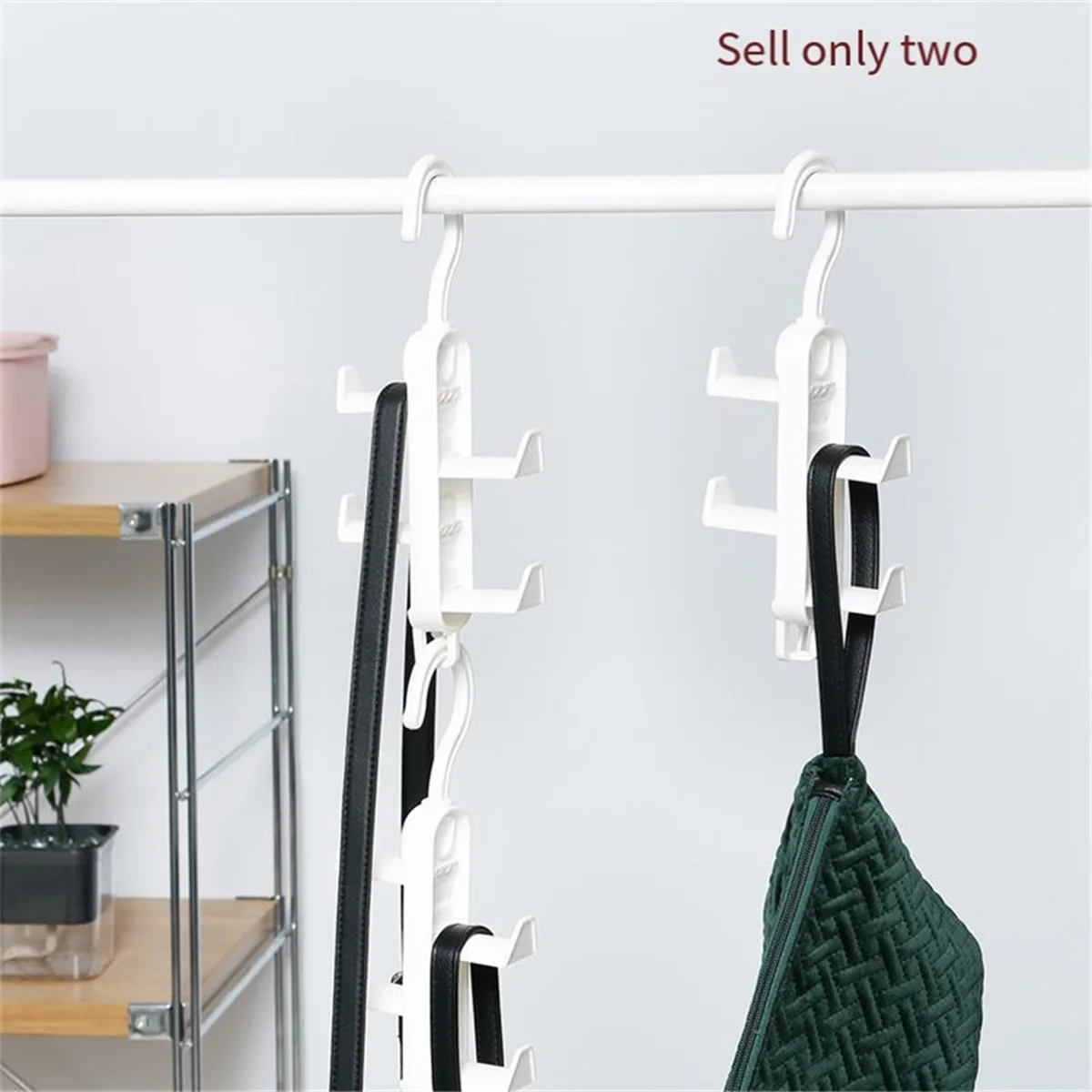 Clarify.pk multi-purpose hanging rack organizer in white hanging on rod holding belts and accessories